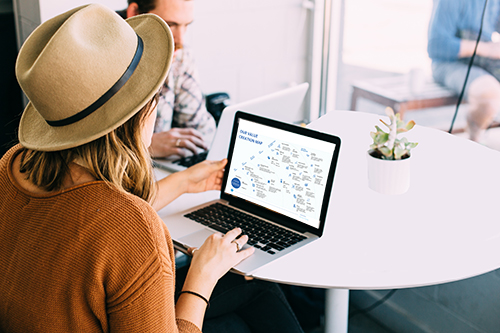 Woman looking at a telecommunication strategy presentation